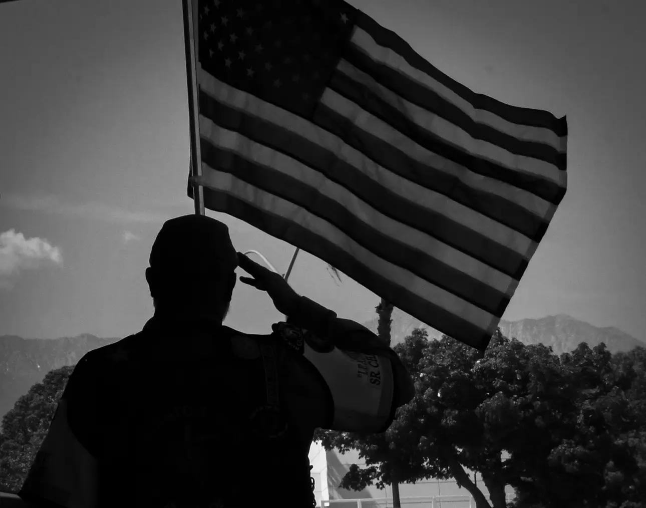 Man saluting the flag of the United States of America