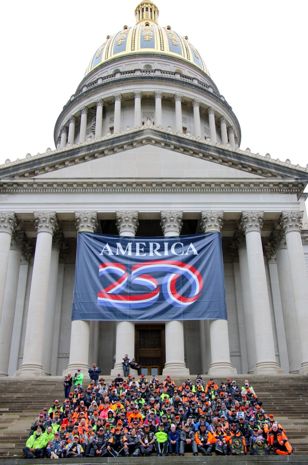on the step of WV state capitol